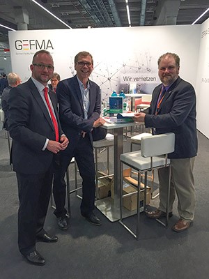 Book Signing A conference attendee (left) meeting with editors Michael May (center) and Geoff Williams (right) at a book signing event in Frankfurt, Germany